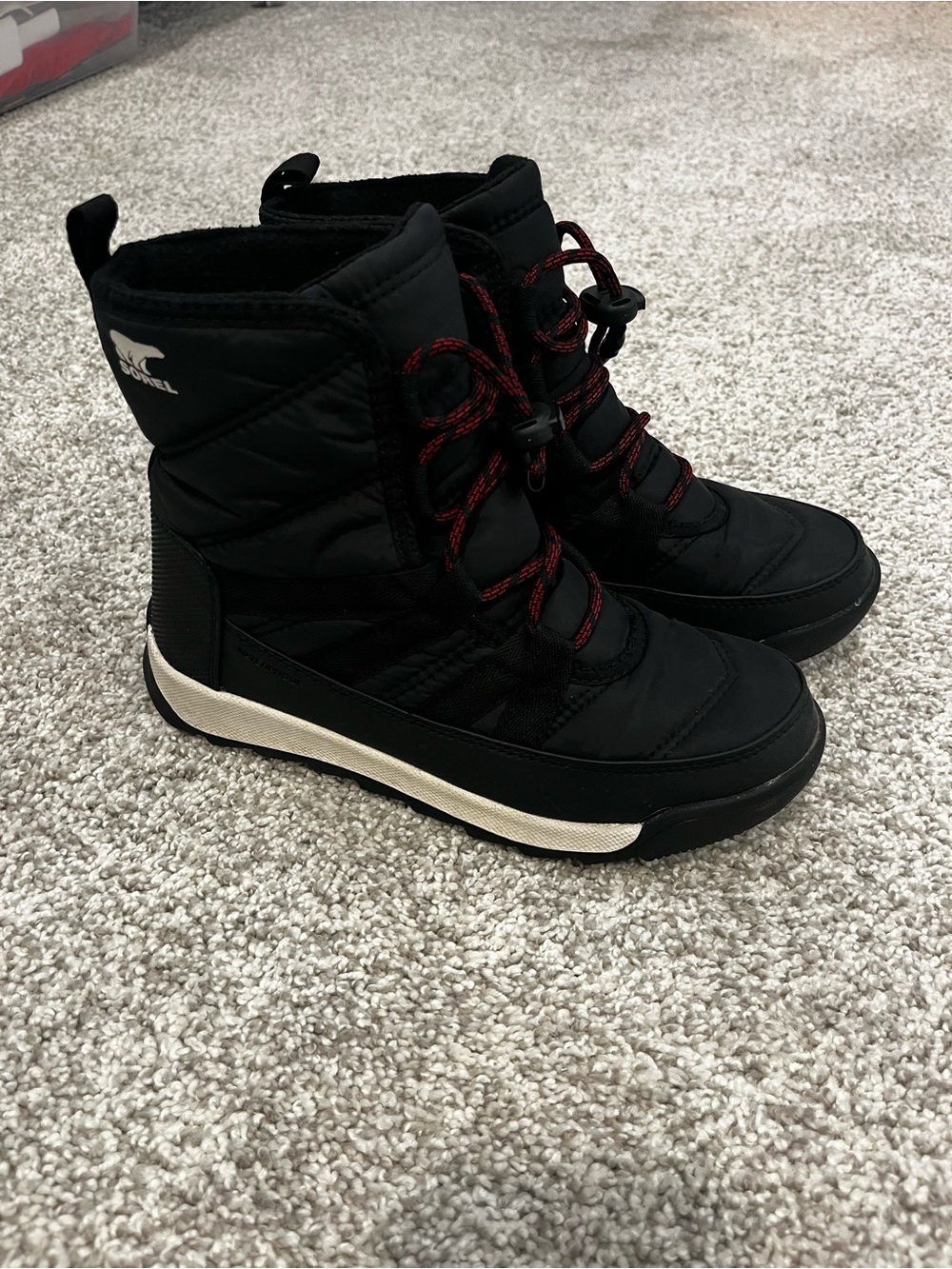 Sorel Kids Black Snow Boots with Red Lace Accents
